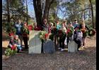 Community members, including Rep. Mark Smith (center), gather on Dec. 13 for a Wreaths Across America ceremony at the Old Ruins/McDowell Cemetery in the Oak Bluff subdivision off Clements Ferry Road.