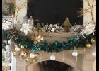 The fireplace in this home at 428 Ralston Creek Street, a stop on the “Christmas on the Creek” home tour, dazzles with festive holiday ribbon, garland and ornaments. 
